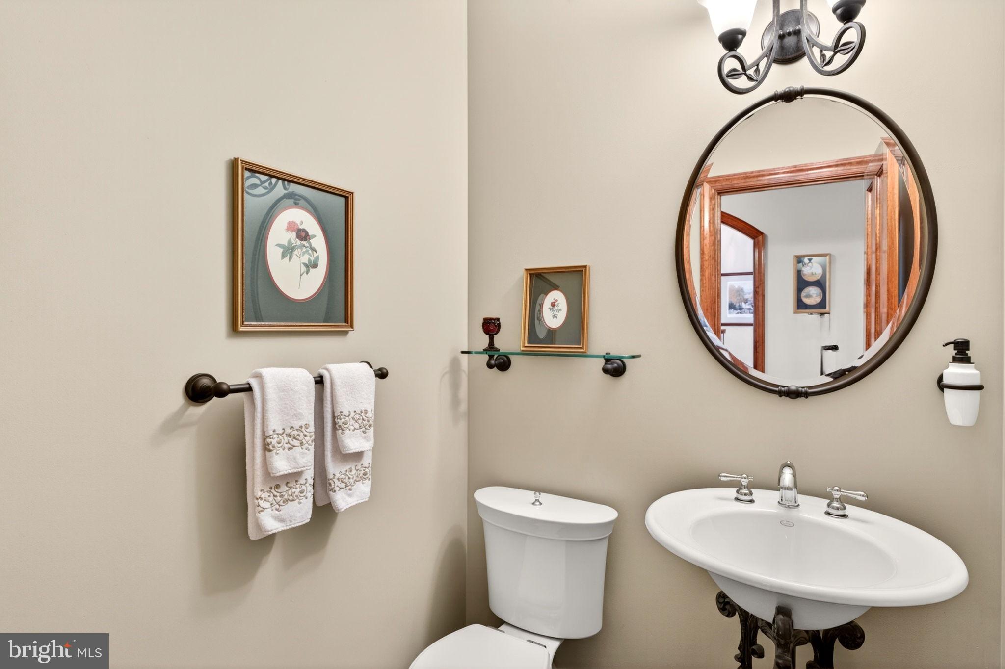 3814 Rocks Station Road Street, MD 21154 - Photo 44 of 70 a bathroom with a toilet a sink and a mirror