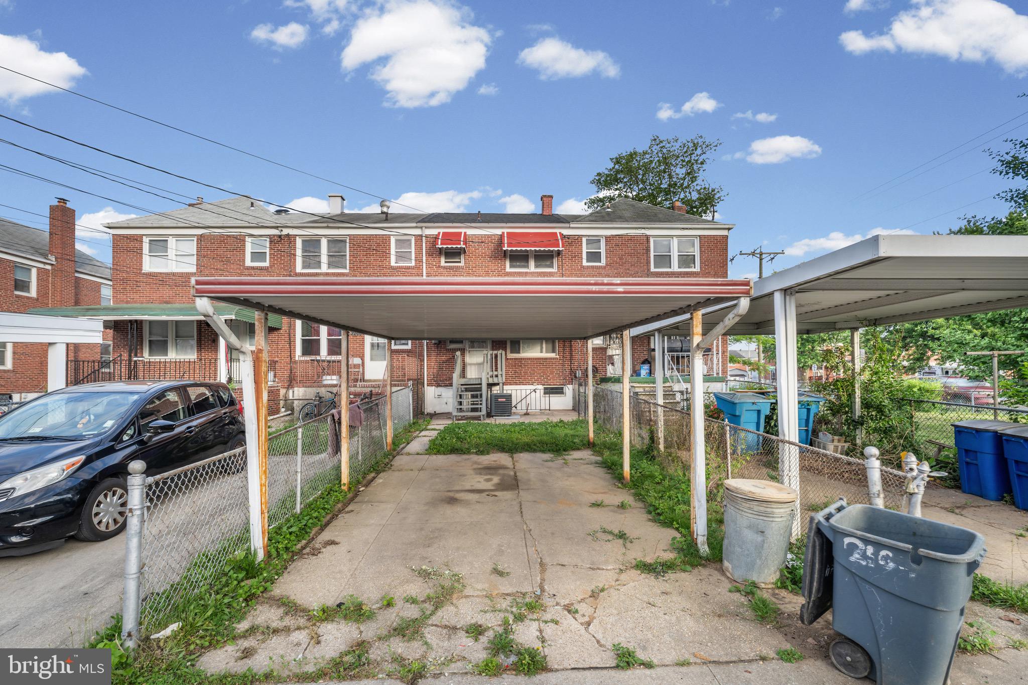 2203 Redthorn Road Baltimore, MD 21220 - Photo 22 of 23 a view of a brick building next to a yard