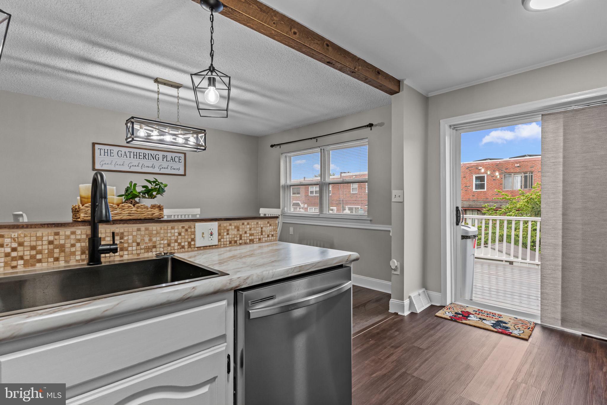 12705 Medford Road Philadelphia, PA 19154 - Photo 12 of 29 a kitchen with a sink a counter space and wooden floor