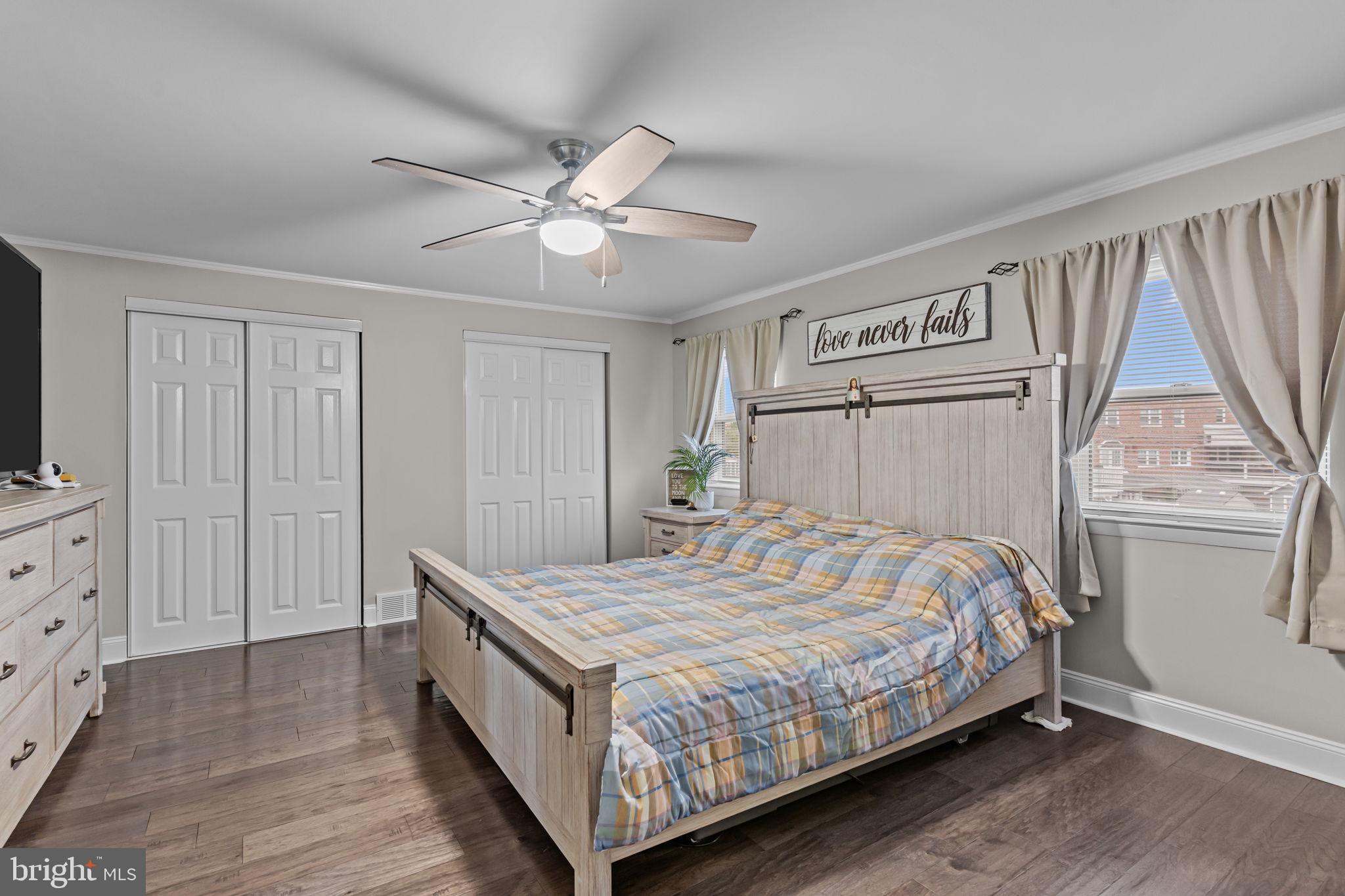 12705 Medford Road Philadelphia, PA 19154 - Photo 15 of 29 a bedroom with a bed and a chandelier
