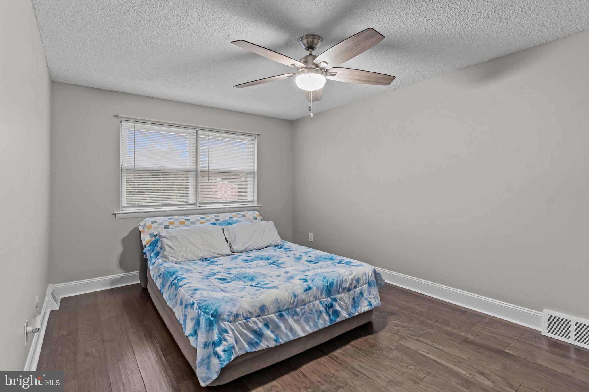 12705 Medford Road Philadelphia, PA 19154 - Photo 17 of 29 a bedroom with a bed and window
