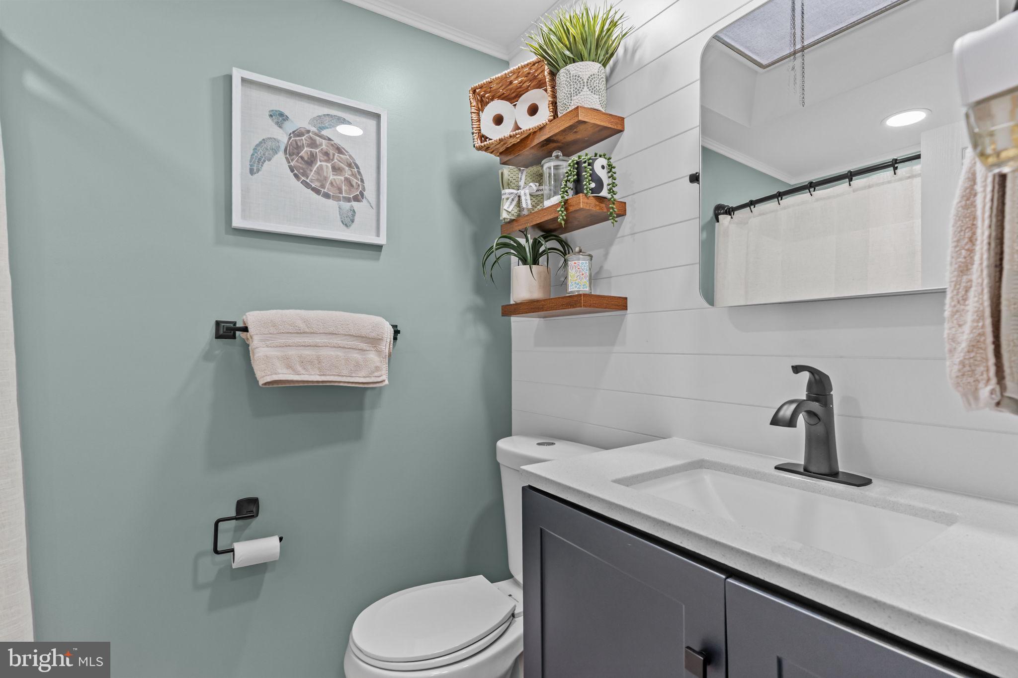 12705 Medford Road Philadelphia, PA 19154 - Photo 19 of 29 a bathroom with a sink a mirror and toilet