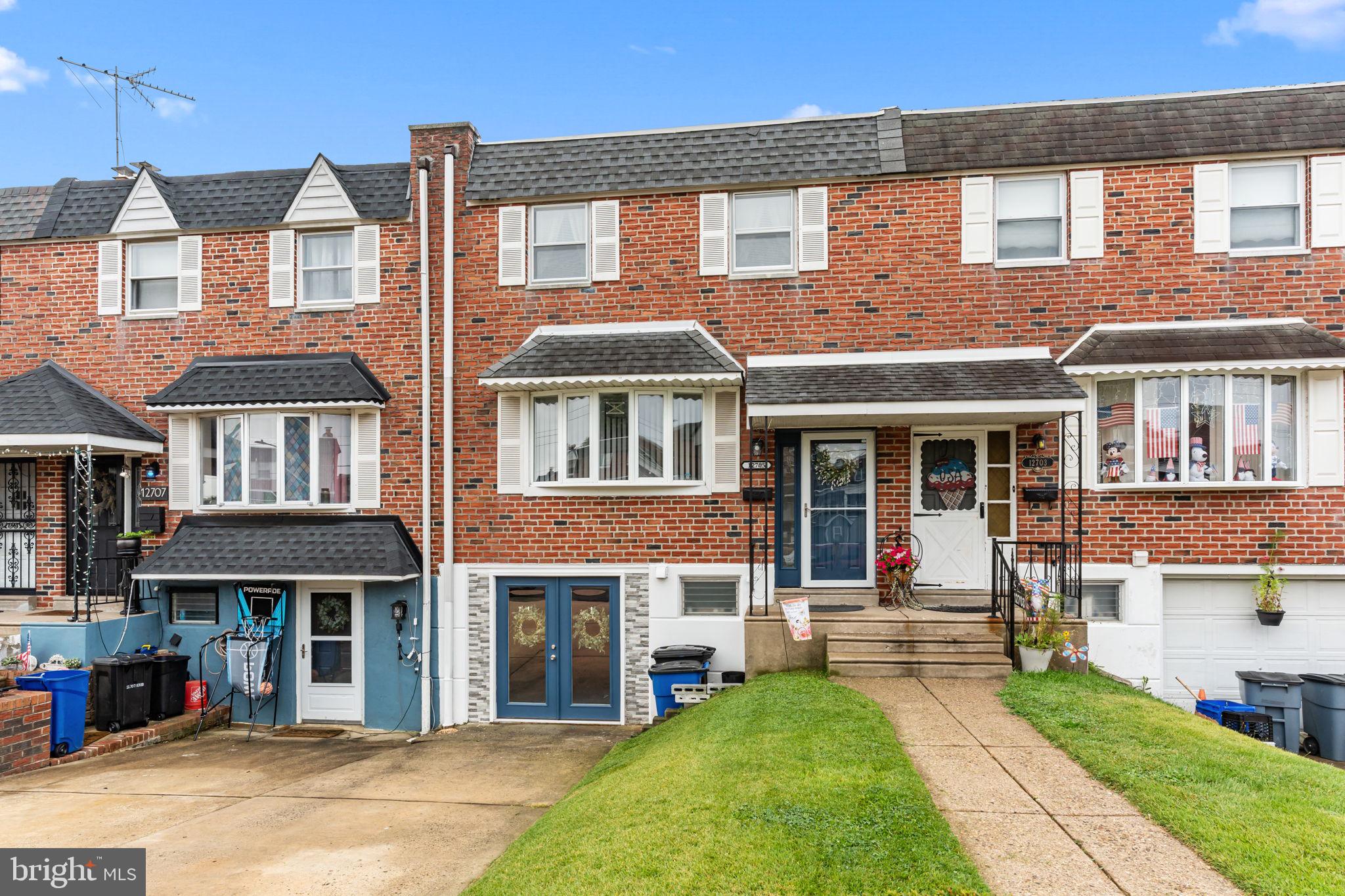 12705 Medford Road Philadelphia, PA 19154 - Photo 2 of 29 a front view of a house with a yard