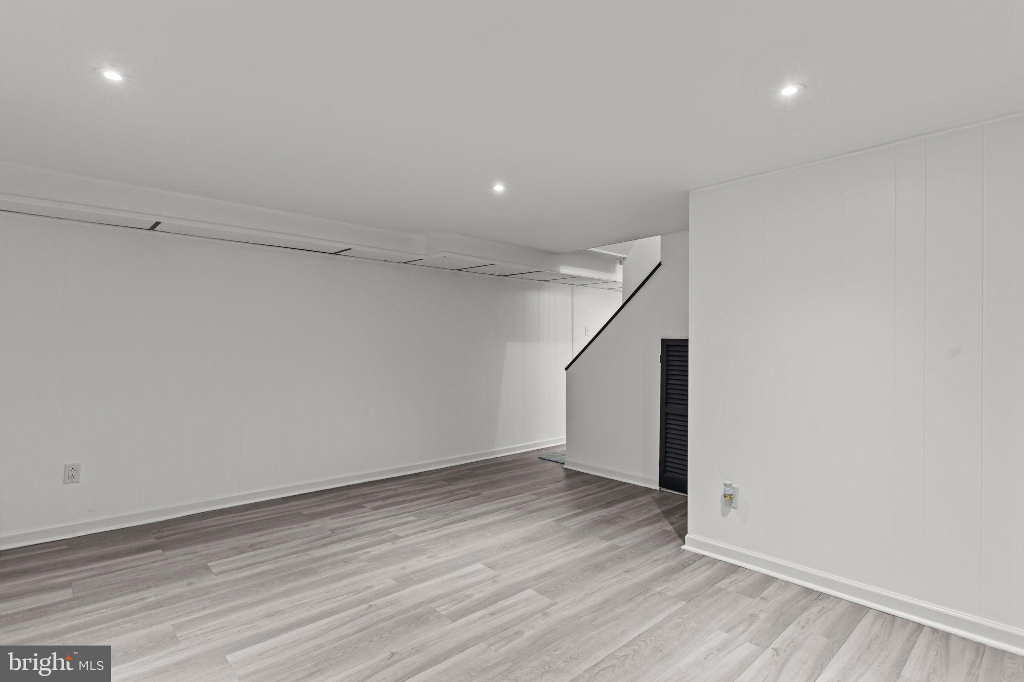 12705 Medford Road Philadelphia, PA 19154 - Photo 22 of 29 an empty room with wooden floor and windows