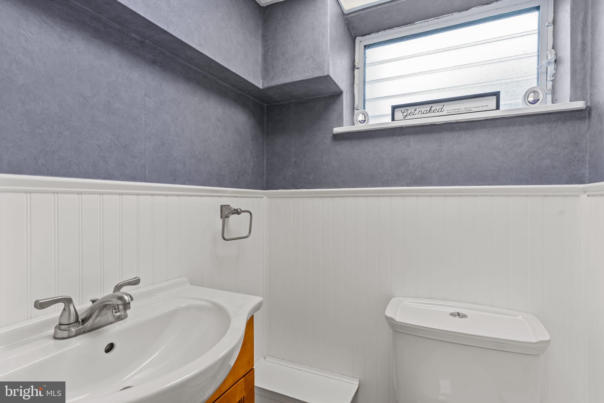 12705 Medford Road Philadelphia, PA 19154 - Photo 24 of 29 a bathroom with a sink a toilet and a window