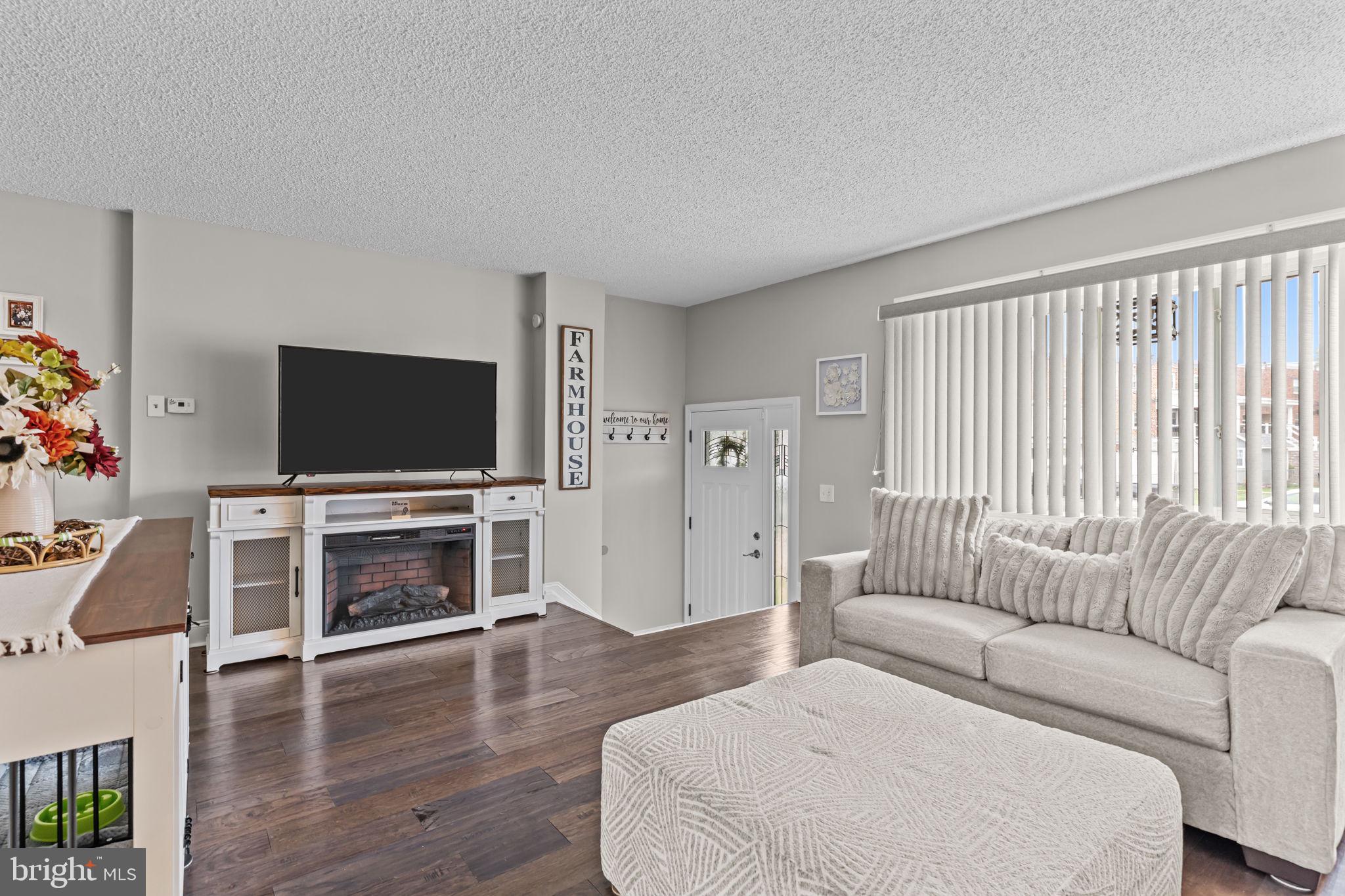 12705 Medford Road Philadelphia, PA 19154 - Photo 6 of 29 a living room with furniture and a flat screen tv