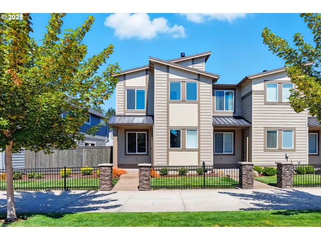 a house that has a tree in front of the house
