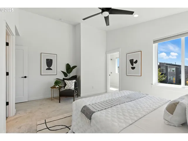 a bedroom with a bed couch and window