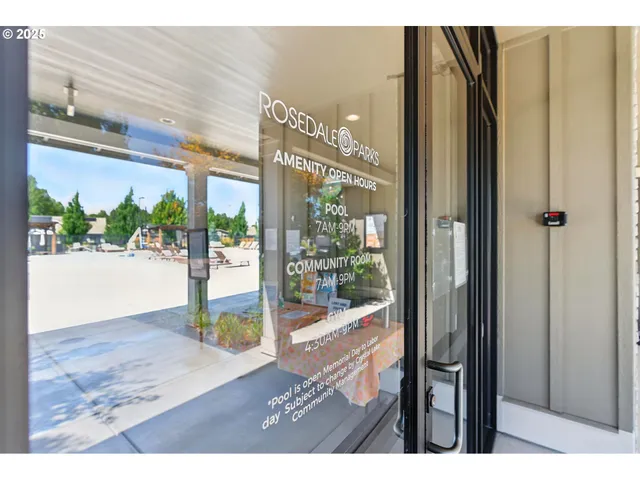 a view of a living room and floor to ceiling window