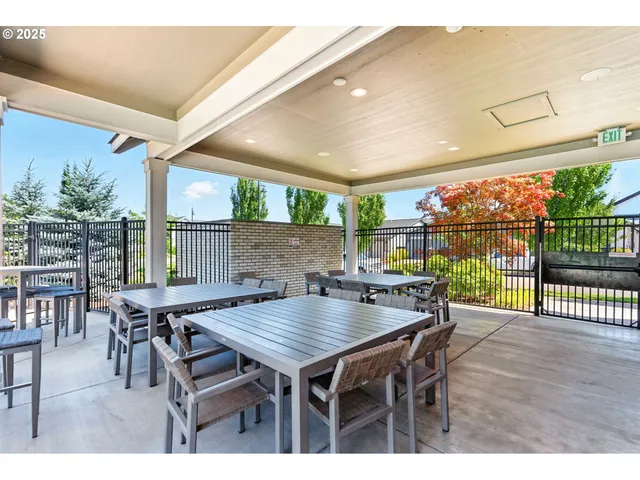 a dining table with chairs and wooden floor