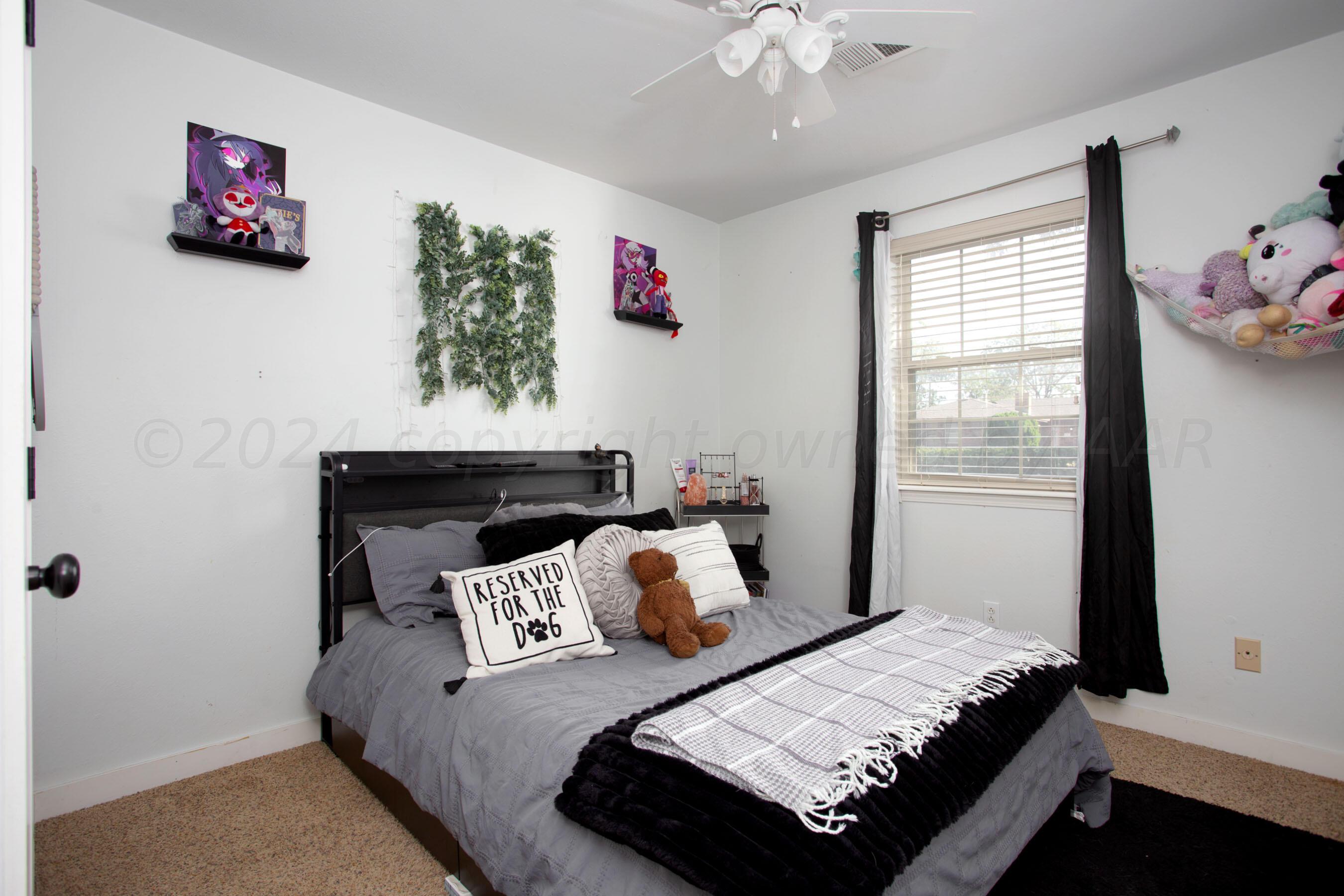 5109 Navajo Trail Amarillo, TX 79110 - Photo 15 of 29 a bed room with a bed and a window
