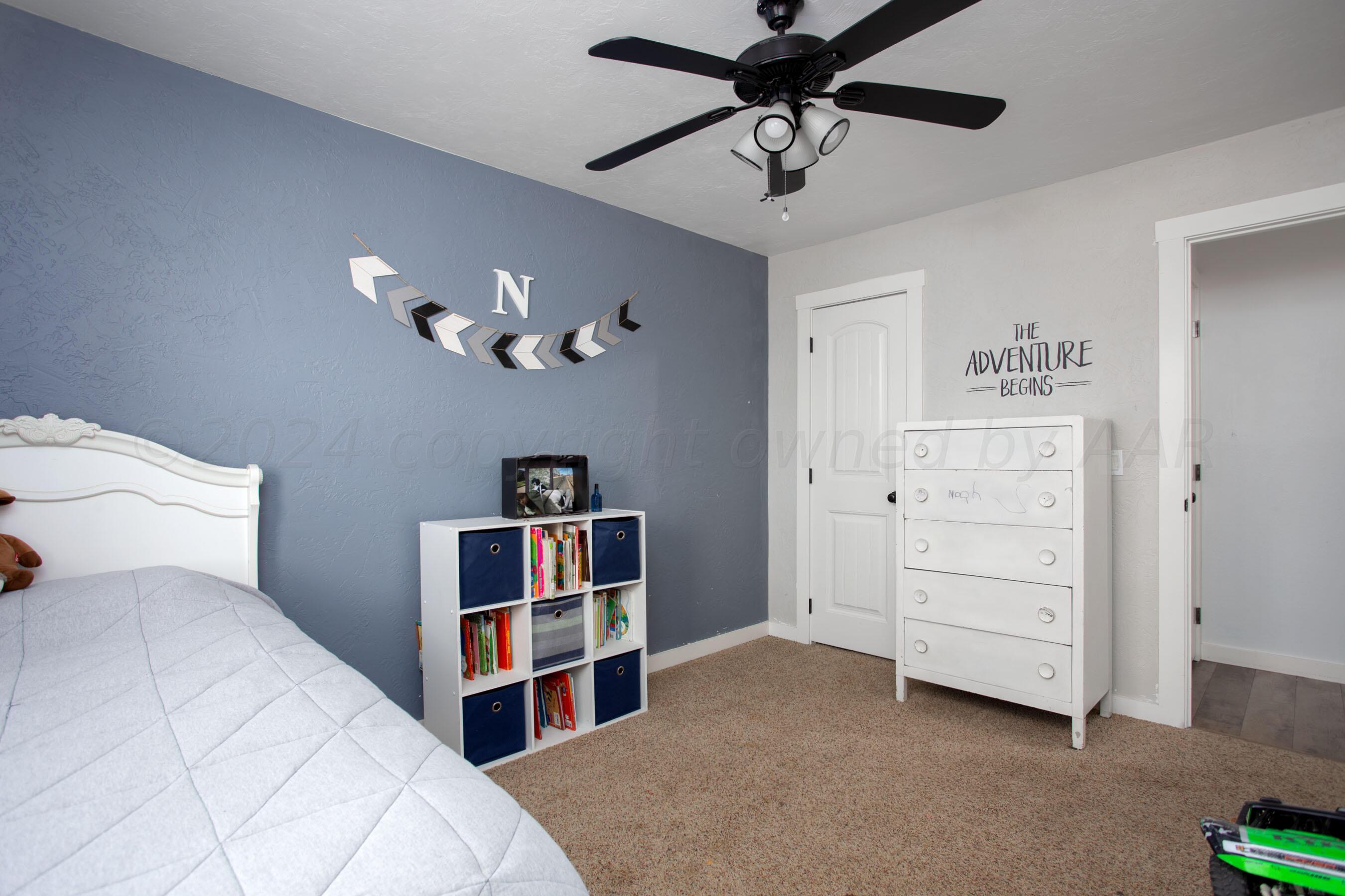 5109 Navajo Trail Amarillo, TX 79110 - Photo 20 of 29 a view of a bedroom with closet and cabinet