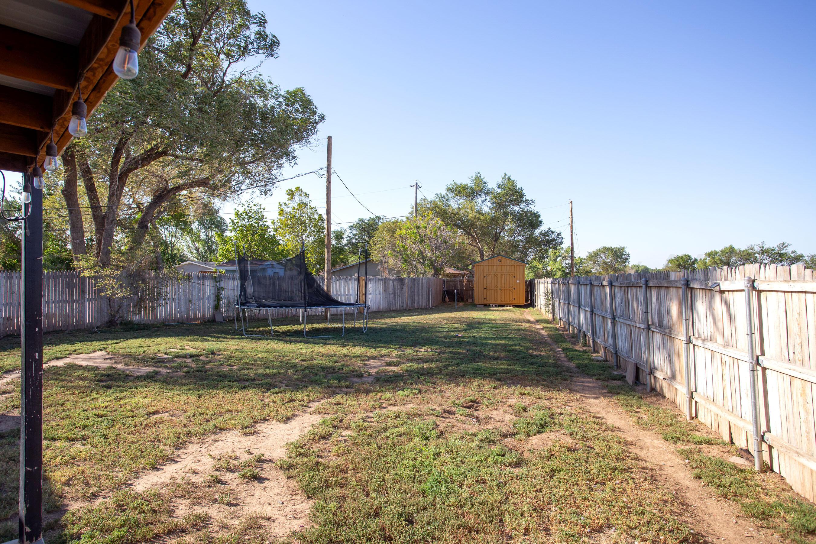 5109 Navajo Trail Amarillo, TX 79110 - Photo 27 of 29 a view of a yard with wooden fence