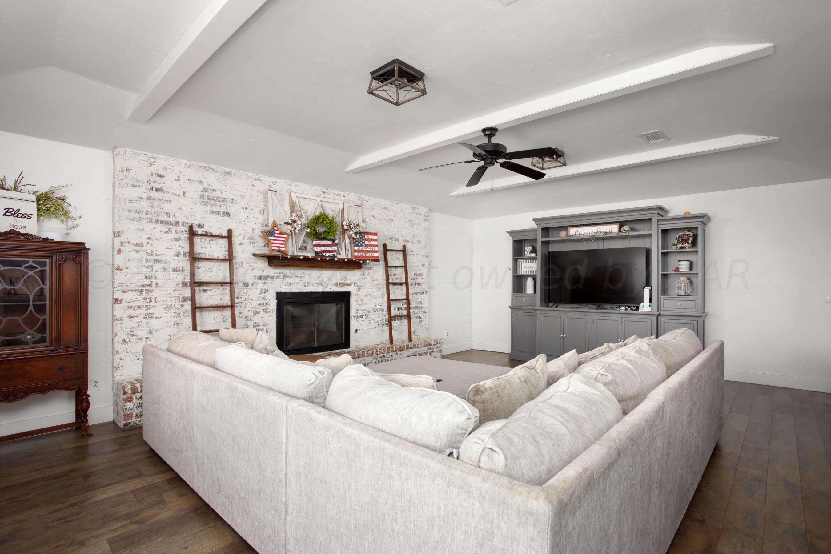 5109 Navajo Trail Amarillo, TX 79110 - Photo 6 of 29 a living room with furniture and a fireplace