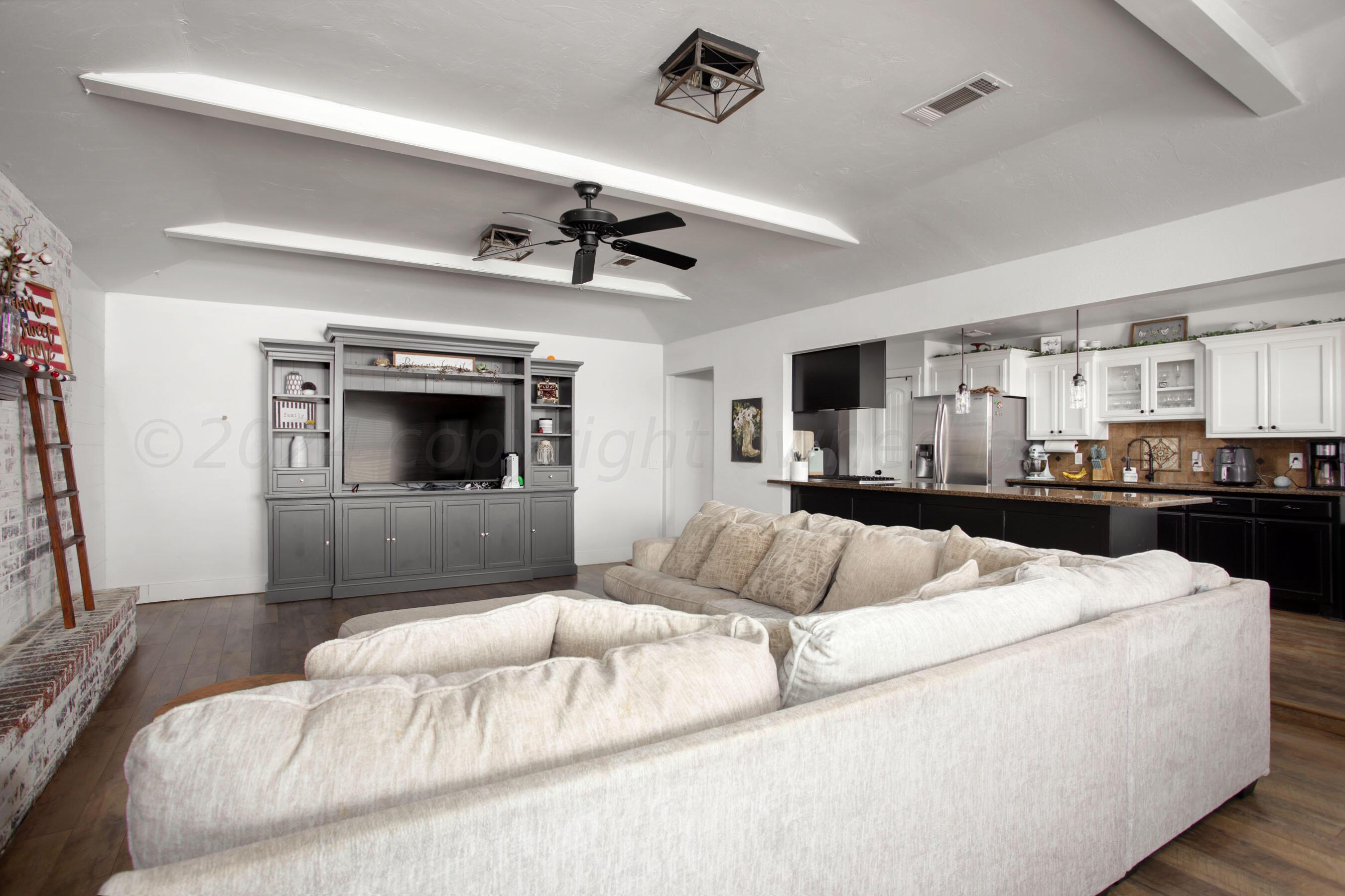 5109 Navajo Trail Amarillo, TX 79110 - Photo 7 of 29 a living room with furniture and a fireplace