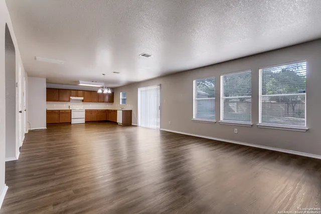 a view of kitchen with furniture and wooden floor