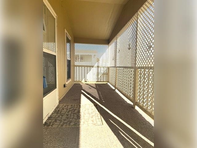 3251 E Road, Unit 11 Clifton, CO 81520 - Photo 3 of 15 a view of balcony and wooden floor
