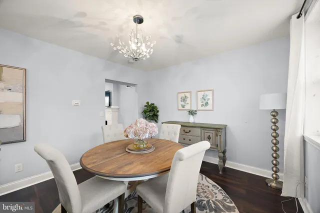 a kitchen with stainless steel appliances kitchen island granite countertop a kitchen island a stove a table and chairs