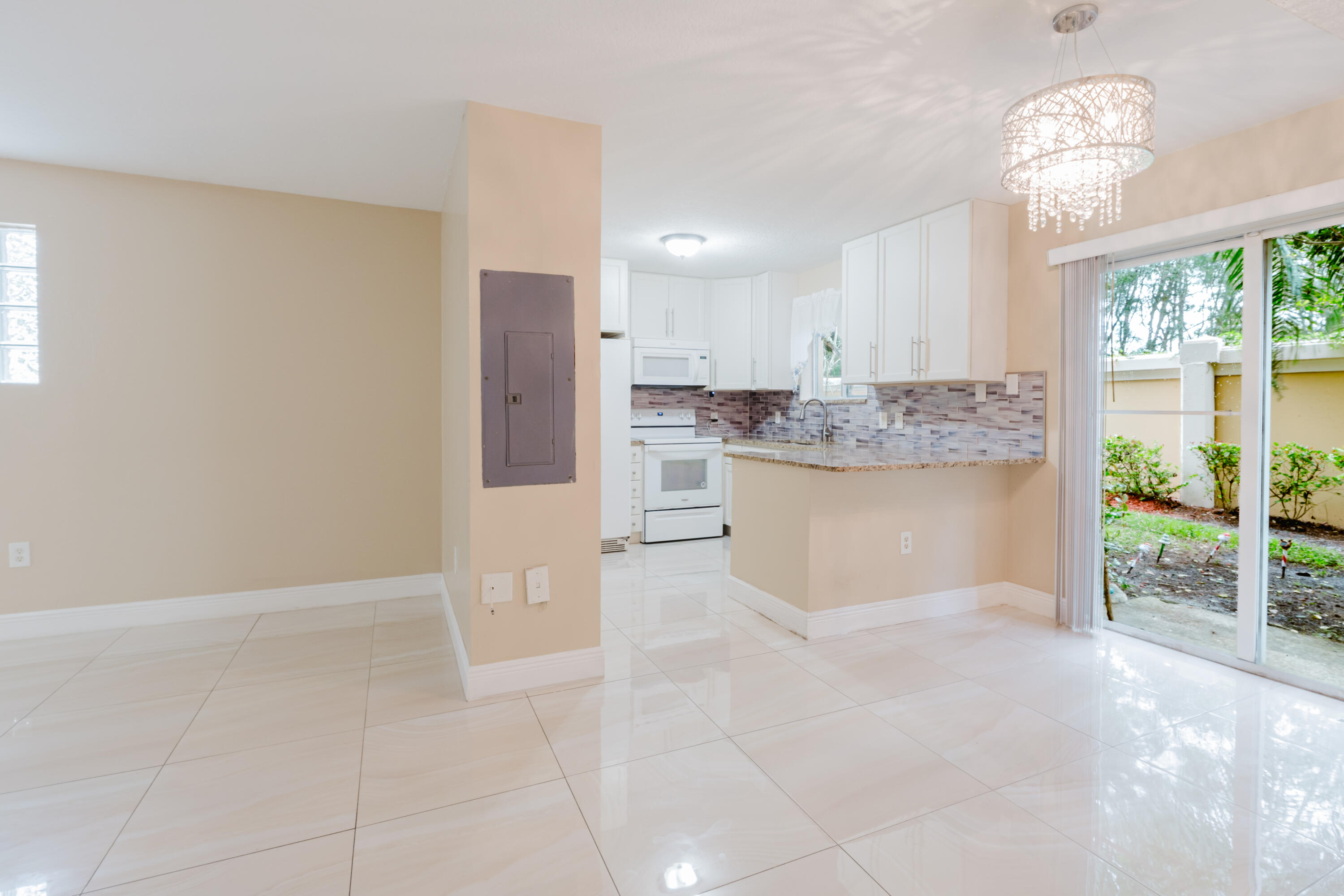 a view of a kitchen with a sink and a window