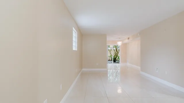 a view of an empty room and window