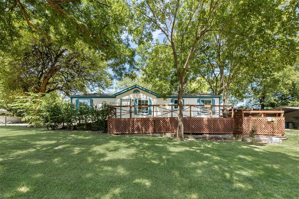 120 Bass Road Point, TX 75472 - Photo 1 of 1 Main house deck and a lawn