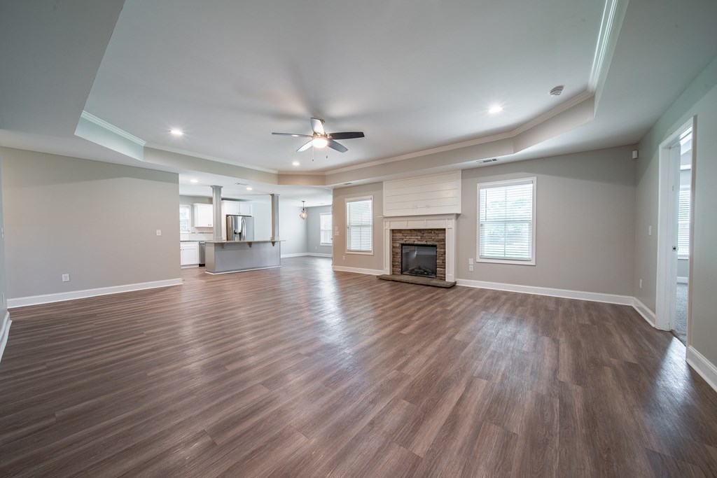 16 Maxwell Drive Fort Mitchell, AL 36856 - Photo 16 of 25 an empty room with wooden floor fireplace and windows