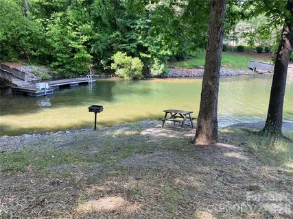 a view of a lake with a yard