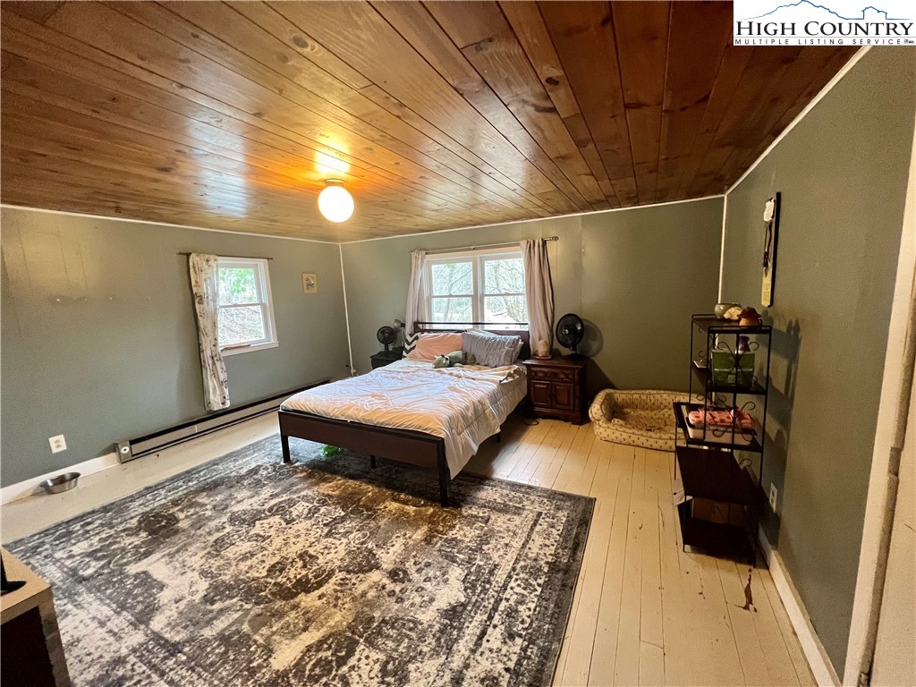 2601 Mountaindale Road Vilas, NC 28692 - Photo 7 of 14 a bedroom with double bed and a window