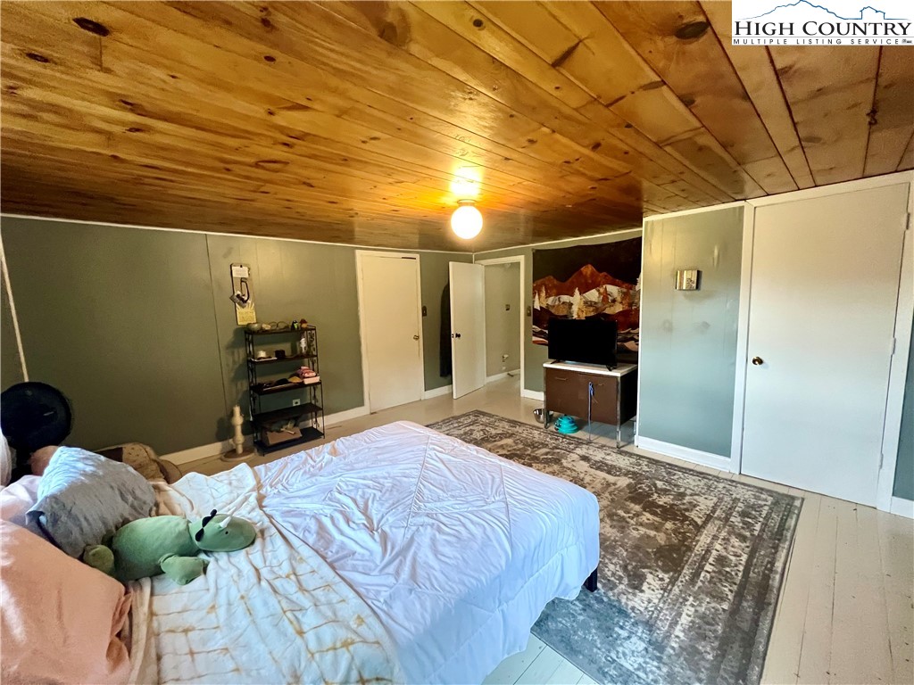 2601 Mountaindale Road Vilas, NC 28692 - Photo 8 of 14 a bed room with a bed and a couch