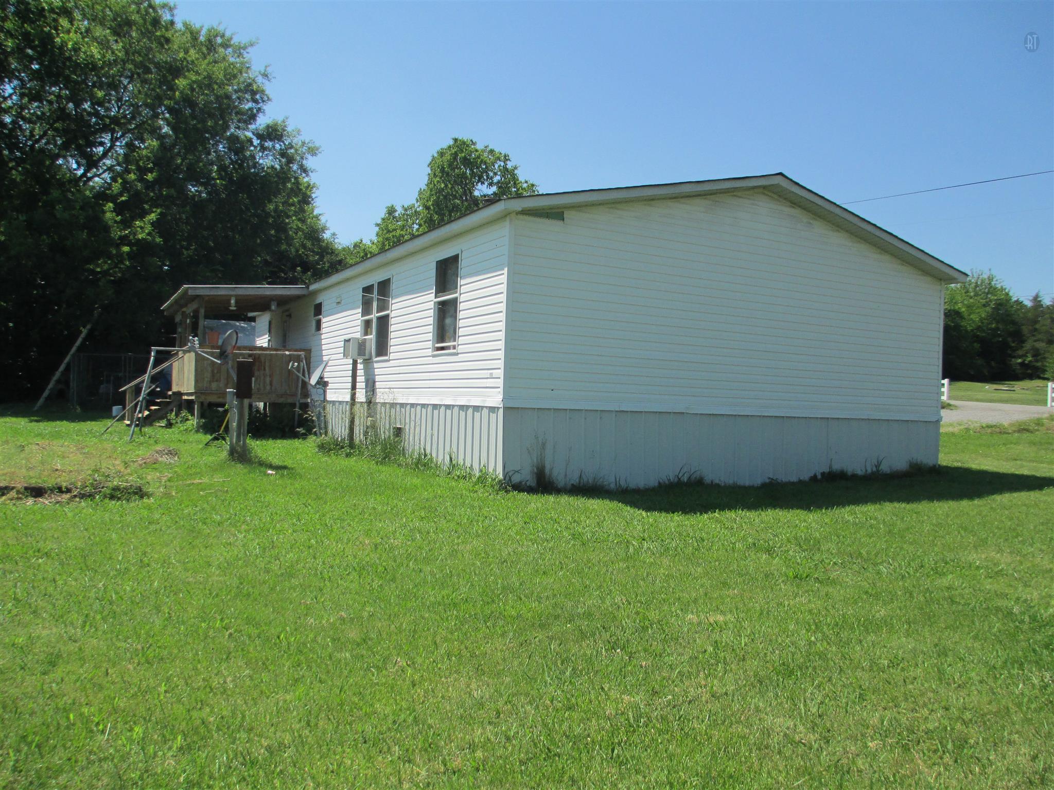 832 Roberts Road Watertown, TN 37184 - Photo 10 of 20 a view of a backyard with potted plants and large trees