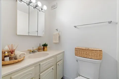 a kitchen with stainless steel appliances white cabinets and a sink