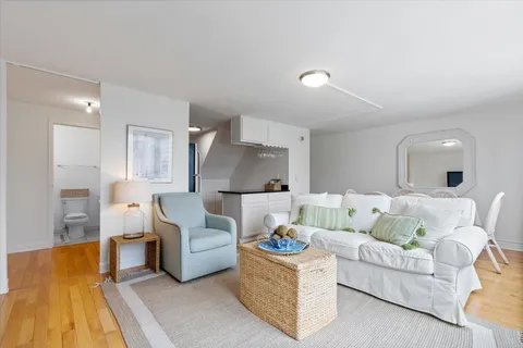 a living room with furniture and a table