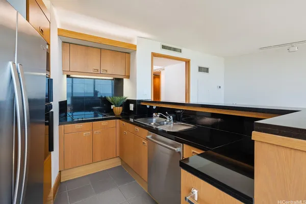 a view of an empty room and a window