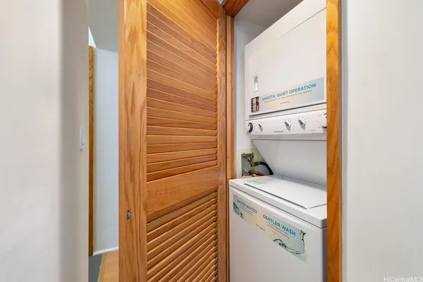 a bathroom with a granite countertop shower sink and mirror