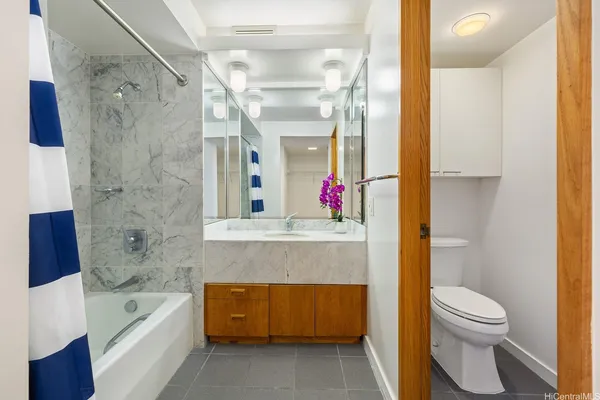 a bathroom with a bathtub and a sink
