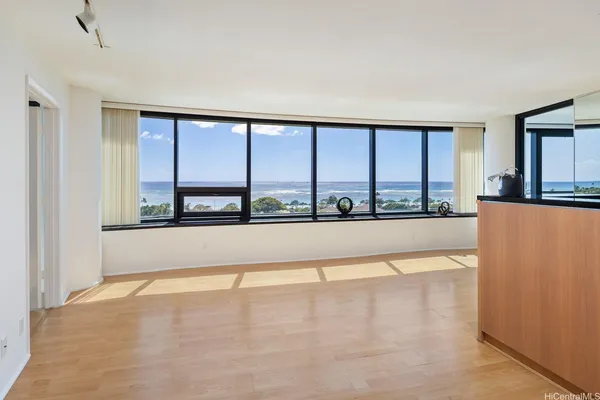 a view of an empty room with a large window