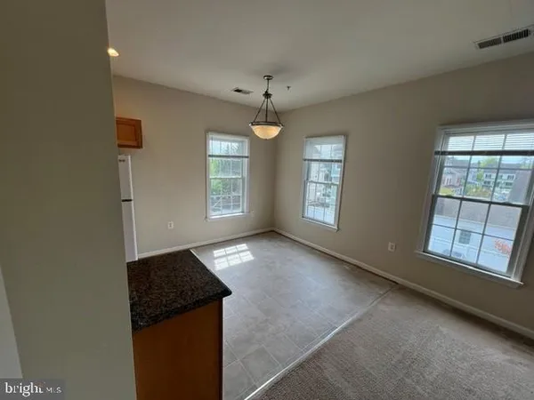 a view of kitchen and windows