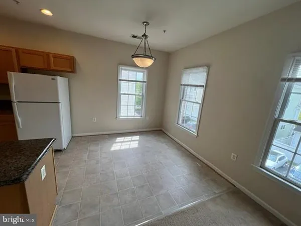 a kitchen with a sink a stove and refrigerator
