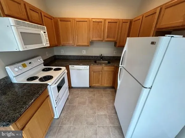 a view of room with window and hardwood floor