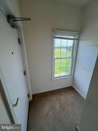 a view of empty room with windows