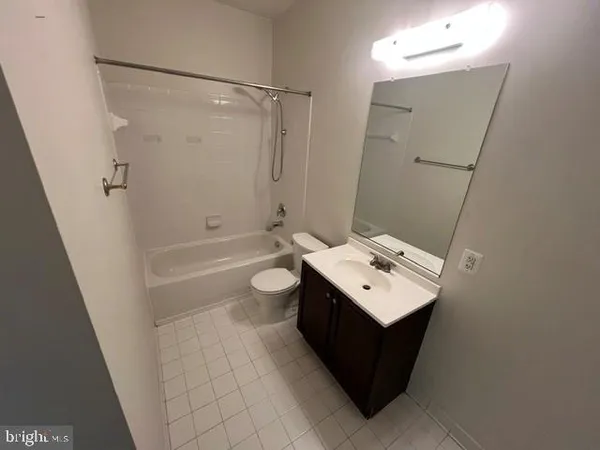 a bathroom with a sink and shower