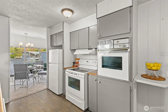 a kitchen with a stove and a refrigerator