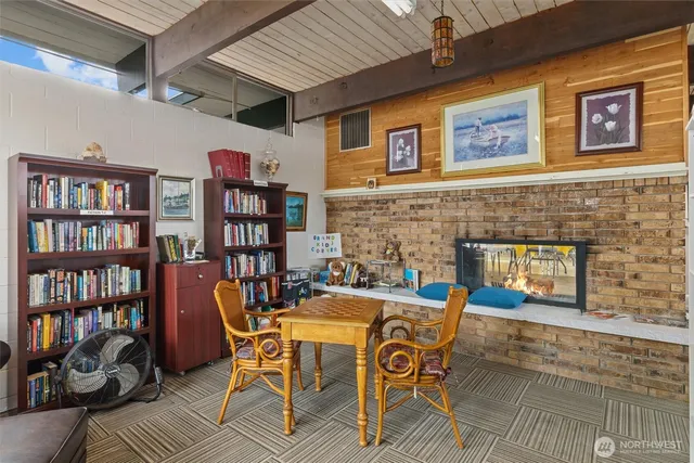 a dining room with furniture and a book shelf