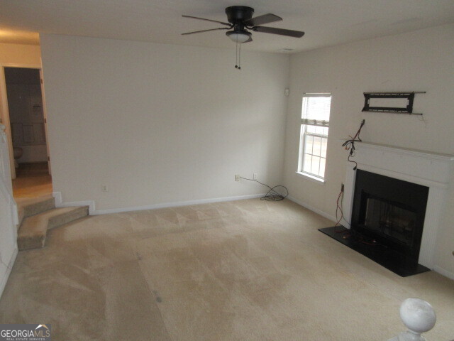 12237 Dickson Road Hampton, GA 30228 - Photo 5 of 14 a view of empty room with a fireplace