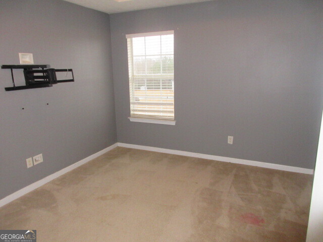 12237 Dickson Road Hampton, GA 30228 - Photo 9 of 14 an empty room with a window