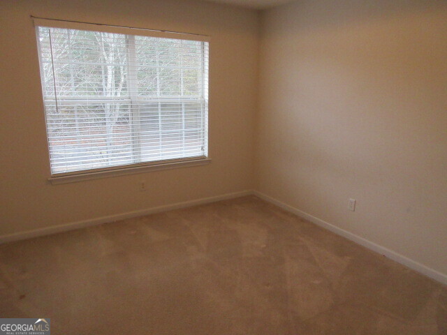 12237 Dickson Road Hampton, GA 30228 - Photo 10 of 14 an empty room with a window