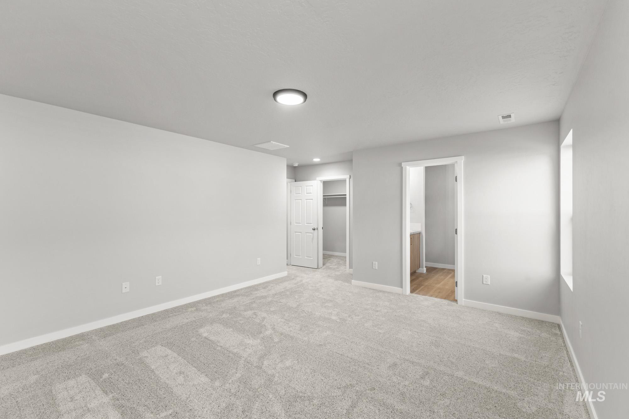 436 Merlin Court Middleton, ID 83644 - Photo 18 of 20 Spacious room featuring light gray carpeting, neutral wall finishes, and a single window