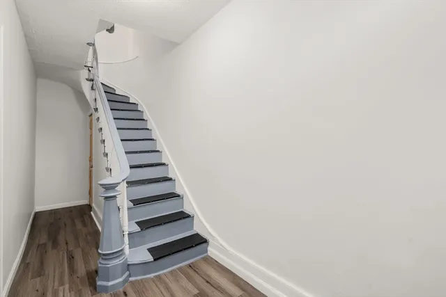 a view of entryway with wooden floor
