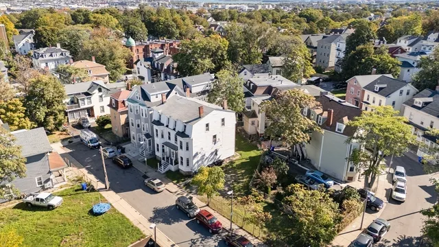 an aerial view of multiple house with outdoor space