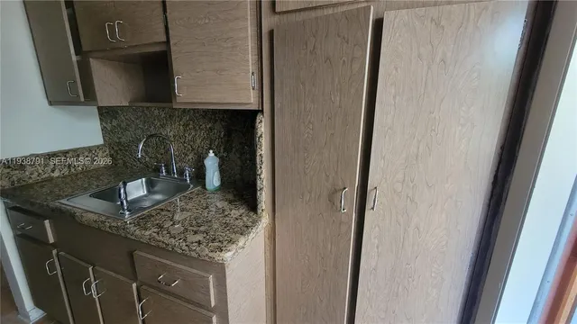 a refrigerator freezer sitting in a kitchen